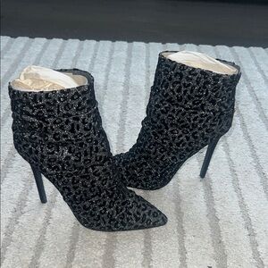 Size 8.5. Brand new Elegant Black / silver Stiletto Ankle Boots
